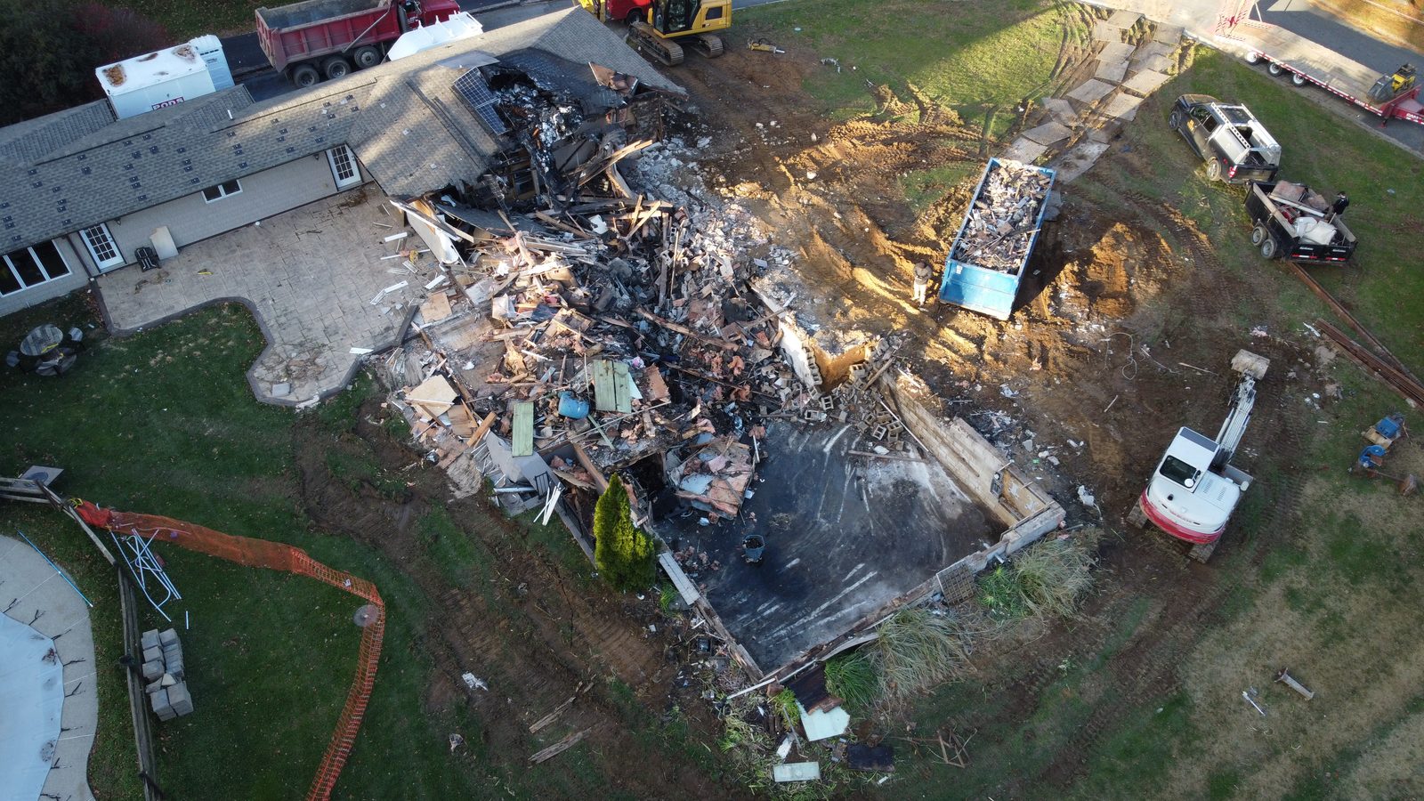 Aerial view of the fire-damaged home during demolition