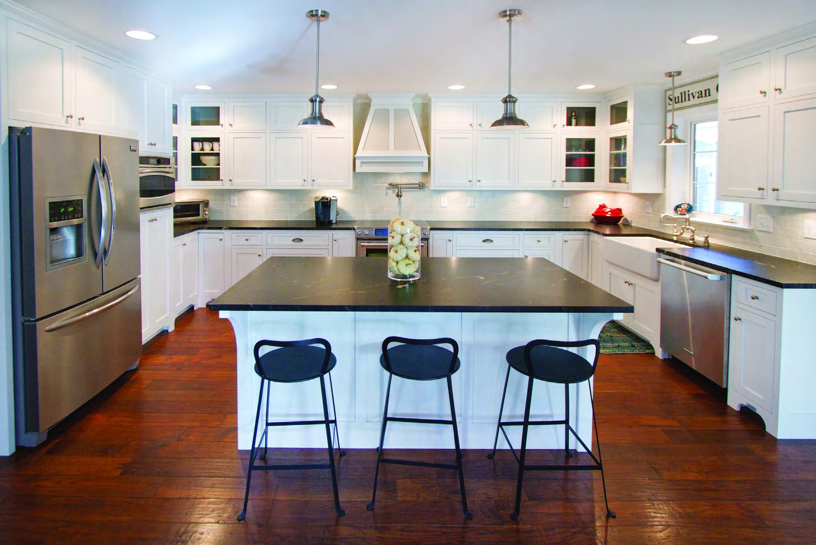 Great room with transom-topped windows