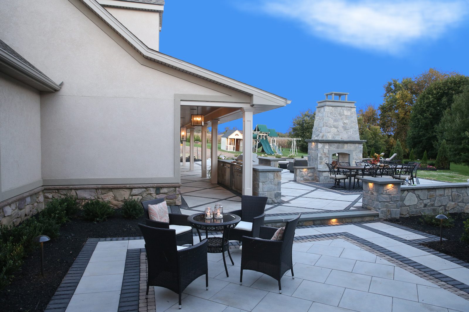 Stone outdoor fireplace and dining patio