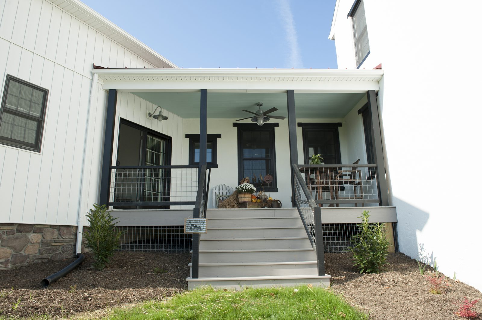 Back porch with black trim and metal roof