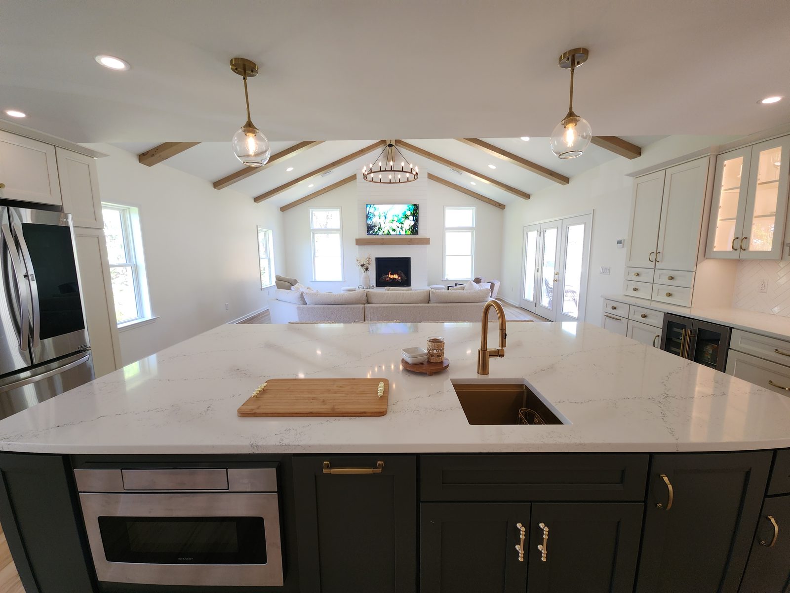 Great room with vaulted beam ceiling and kitchen island